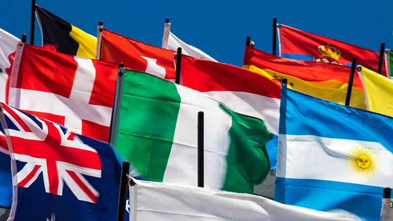 Cluster of country flags blowing in the wind