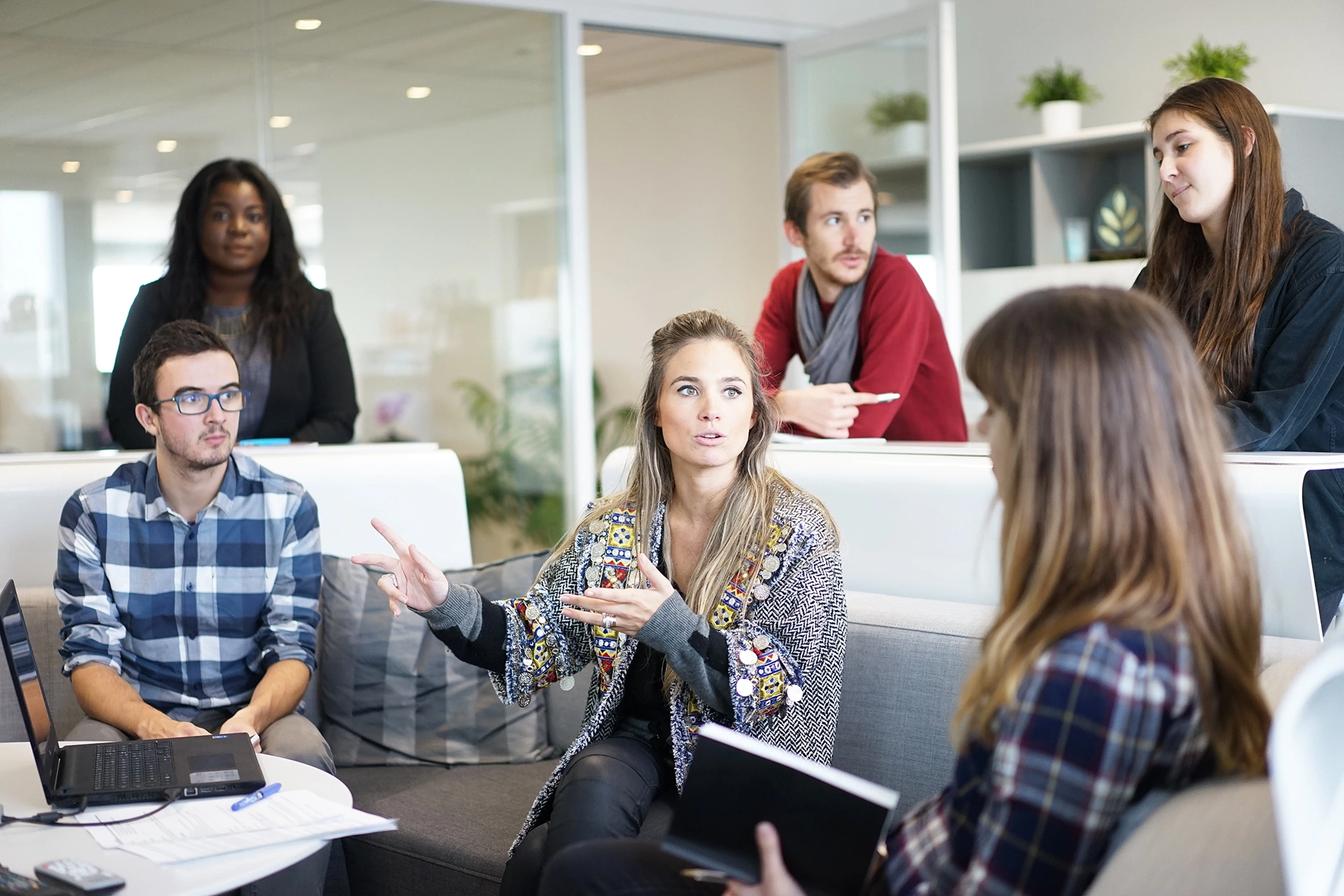 Group of casually dressed young people in informal meeting