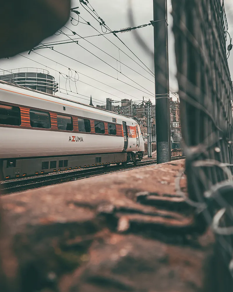 LNER train travelling towards urban conurbation