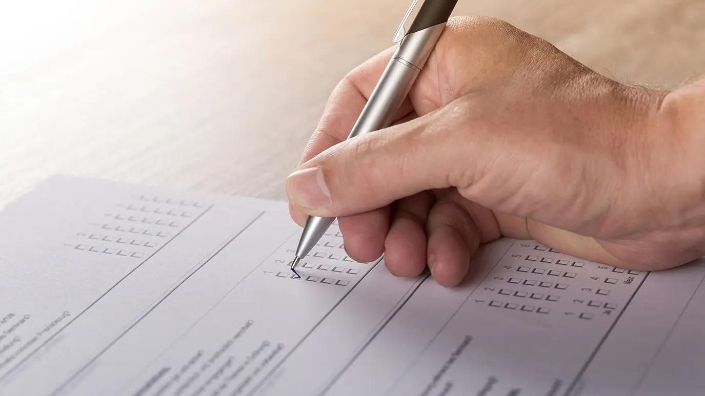 Close-up of person filling in a form